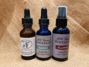 3 1818 Farms bottles: the argan oil face serum, the fleece-scented beard oil, and the flannel-scented shave oil