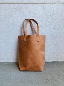 a brown leather tote bag from ethic goods