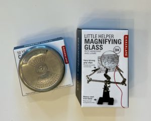 a 50 year calendar on the left and a mini magnifying glass on the right