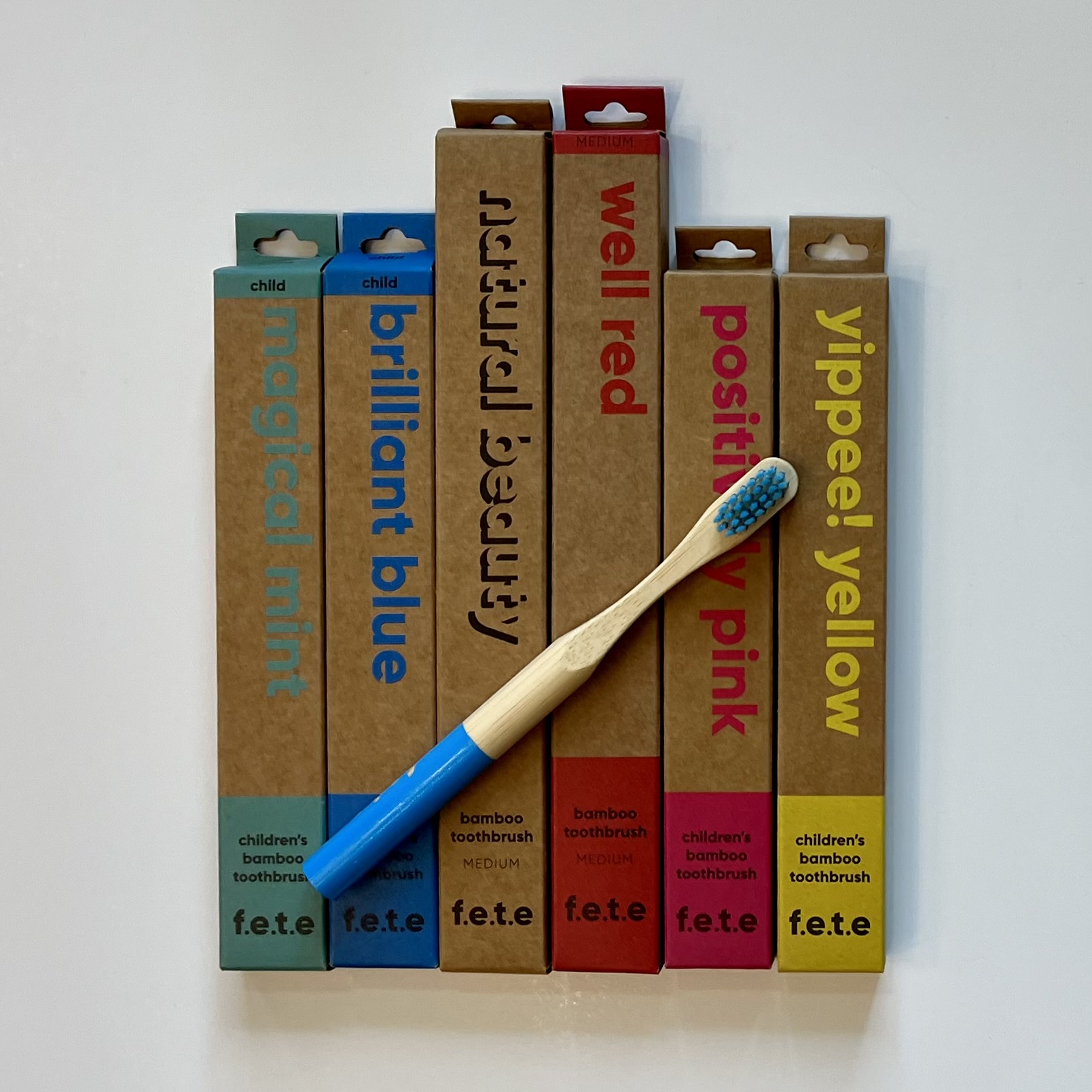 a variety of colors of bamboo toothbrushes