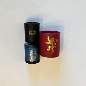 three candles with Game of Thrones images on them