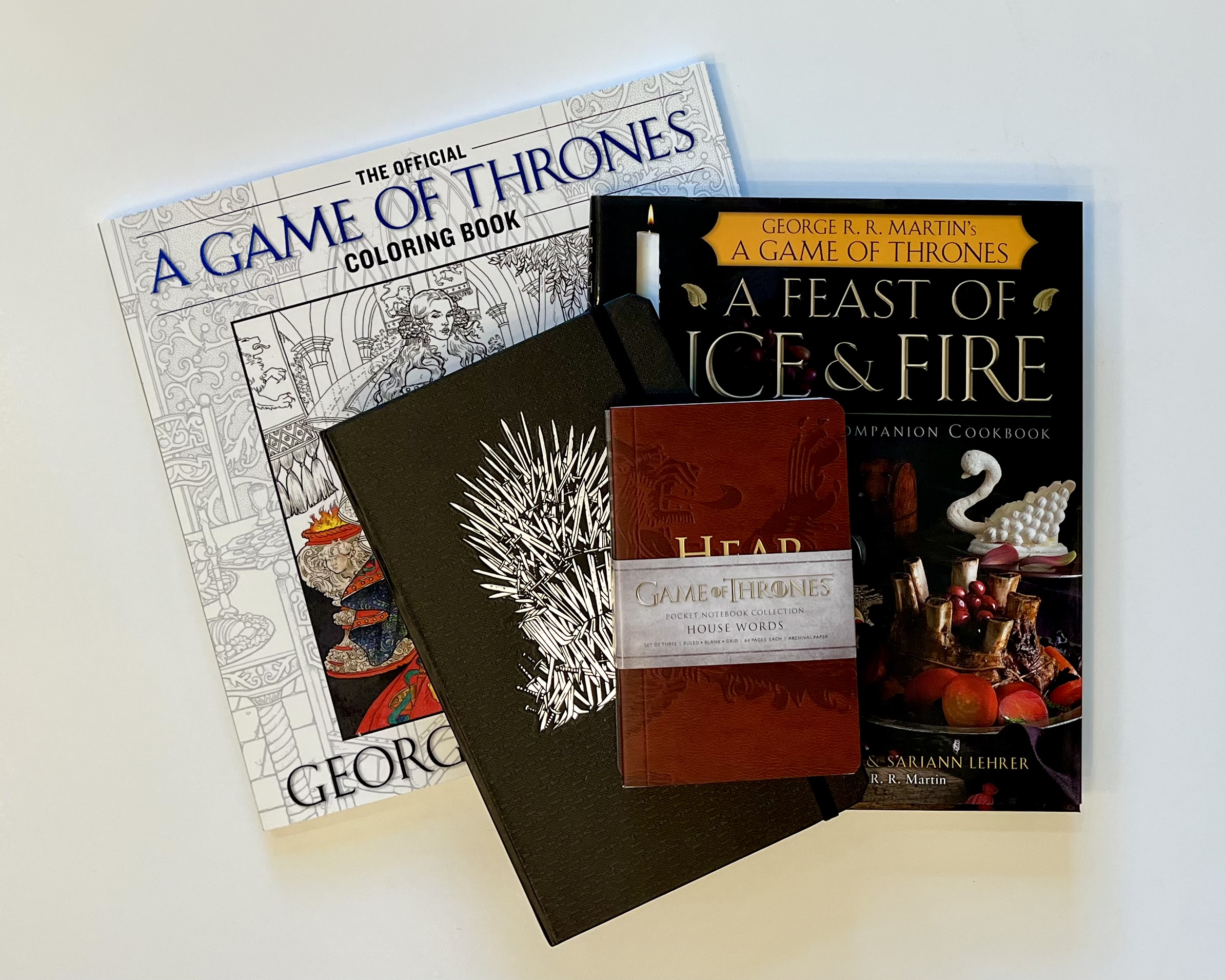 a Game of Thrones coloring book, cookbook, and notebooks