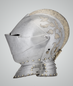 a steel, brass and leather helmet with etching and gilding