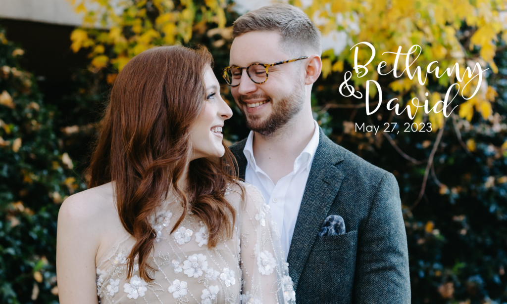 an engagement photo of David holding Bethany as she turns and smiles at him